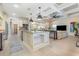 Open kitchen with granite island, stainless appliances, and seamless access to the living area at 9800 Plumfield Ct., Myrtle Beach, SC 29579