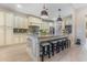 Gourmet kitchen featuring an island with seating, granite countertops, and ample cabinet space at 9800 Plumfield Ct., Myrtle Beach, SC 29579