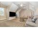 Loft space with a large screen TV, comfortable seating, and a ceiling fan at 9800 Plumfield Ct., Myrtle Beach, SC 29579