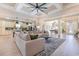 Open-concept living space with large sectional, kitchen island, and elegant decor at 9800 Plumfield Ct., Myrtle Beach, SC 29579