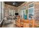 Sun room with brick walls, tile flooring, and casual dining at 9800 Plumfield Ct., Myrtle Beach, SC 29579