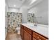 Bathroom featuring a vanity with a sink and a shower/tub combo with tile at 1018 Red Sky Ln. # 101, Murrells Inlet, SC 29576