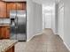 Hallway with tile flooring leading to the front door and the kitchen at 1018 Red Sky Ln. # 101, Murrells Inlet, SC 29576