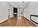 Spacious living room with hardwood floors, a fireplace, and double doors to the backyard at 1018 Red Sky Ln. # 101, Murrells Inlet, SC 29576