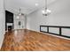 Bright living room with wood flooring, a cozy fireplace, and plenty of natural light at 1018 Red Sky Ln. # 101, Murrells Inlet, SC 29576