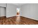 Inviting bedroom with wood floors, a glimpse of the ensuite bathroom, and natural light at 1018 Red Sky Ln. # 101, Murrells Inlet, SC 29576