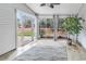 Bright sunroom with tile flooring, a ceiling fan, and lots of windows looking out on the yard at 1018 Red Sky Ln. # 101, Murrells Inlet, SC 29576