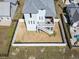 Aerial view of the backyard with a white fence and second-story deck at 108 Fincham Dr., Little River, SC 29566