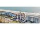 Aerial view of the condo building located on a beach with a swimming area at 1113 N Ocean Blvd. # 101, Surfside Beach, SC 29575