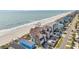 Aerial view showing the location of the condo with a beach and swimming area at 1113 N Ocean Blvd. # 101, Surfside Beach, SC 29575
