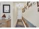 Hallway with tiled floor, mural, wall decorations, and furniture; bright and beach themed at 1113 N Ocean Blvd. # 101, Surfside Beach, SC 29575