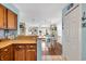 Open layout from kitchen to dining featuring wood cabinetry and bright, airy feel at 1113 N Ocean Blvd. # 101, Surfside Beach, SC 29575