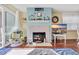 Charming living room featuring a decorative fireplace, beach-themed decor, and comfortable seating at 1113 N Ocean Blvd. # 101, Surfside Beach, SC 29575
