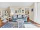 Comfortable living room with stylish sofa, accent tables, and coastal-inspired rug at 1113 N Ocean Blvd. # 101, Surfside Beach, SC 29575
