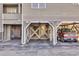 Covered parking area with supports, showing unit numbers, and providing parking for multiple vehicles at 1113 N Ocean Blvd. # 101, Surfside Beach, SC 29575