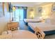 Bright bedroom featuring two beds, a view of the beach and coastal-themed decor at 1205 S Ocean Blvd. # 20409, Myrtle Beach, SC 29577