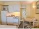 Convenient kitchenette with a stove, sink, microwave, and dining area at 1205 S Ocean Blvd. # 20409, Myrtle Beach, SC 29577