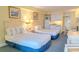 Well-equipped studio with two beds, a dining area, and a functional kitchenette at 1205 S Ocean Blvd. # 20409, Myrtle Beach, SC 29577