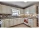 Bright kitchen featuring granite countertops and white cabinetry at 1525 Sunmeadow Dr., Conway, SC 29526