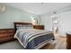 Serene bedroom offers a cozy bed, well-appointed furniture, and easy access to the bathroom, providing a peaceful ambiance at 180 Rothbury Circle # 302, Myrtle Beach, SC 29572