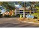 Exterior view of Arrowhead Court, showcasing well-maintained landscaping and mature trees enhancing curb appeal at 180 Rothbury Circle # 302, Myrtle Beach, SC 29572