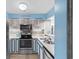 Charming kitchen featuring stainless steel appliances and coastal-themed decor at 180 Rothbury Circle # 302, Myrtle Beach, SC 29572