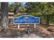 Arrowhead Court sign surrounded by trees and foliage at 180 Rothbury Circle # 302, Myrtle Beach, SC 29572