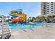 Exciting water park area featuring colorful slides and a lifeguard stand, providing endless fun for all ages at 180 Rothbury Circle # 302, Myrtle Beach, SC 29572