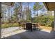 Charming wooden table and chairs set on the back porch, perfect for outdoor dining and entertaining at 1820 Spinnaker Dr., North Myrtle Beach, SC 29582