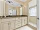 Bright bathroom featuring dual sinks, granite counters, and a glass-enclosed shower at 1820 Spinnaker Dr., North Myrtle Beach, SC 29582