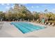 Large community pool with surrounding lounge chairs and umbrellas for relaxing poolside at 1820 Spinnaker Dr., North Myrtle Beach, SC 29582