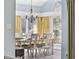 Dining room with a chandelier and large arched window at 1820 Spinnaker Dr., North Myrtle Beach, SC 29582