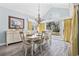 Dining room with a large arched window, chandelier, and sideboard cabinet at 1820 Spinnaker Dr., North Myrtle Beach, SC 29582