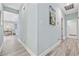Hallway with a view of the dining room in the distance at 1820 Spinnaker Dr., North Myrtle Beach, SC 29582
