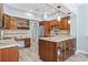 Updated kitchen features wood cabinets, granite countertops, stainless steel appliances, and hardwood floors at 1820 Spinnaker Dr., North Myrtle Beach, SC 29582