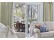 Bright living room view to back porch, featuring a cozy seating area and natural light at 1820 Spinnaker Dr., North Myrtle Beach, SC 29582