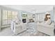 Bright living room with fireplace, plantation shutters, and view to the entry at 1820 Spinnaker Dr., North Myrtle Beach, SC 29582