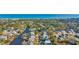 An aerial view shows charming homes nestled among trees along the waterway to the beachfront at 186 Cayman Loop, Pawleys Island, SC 29585