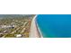 Coastal homes nestled among trees with access to the beach, as shown in this aerial community view at 186 Cayman Loop, Pawleys Island, SC 29585