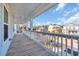 This covered balcony provides lovely neighborhood views at 186 Cayman Loop, Pawleys Island, SC 29585