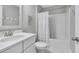 Bathroom with white vanity, toilet, and a shower with shower curtain at 186 Cayman Loop, Pawleys Island, SC 29585