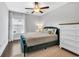Bedroom featuring hardwood floors, neutral paint, a decorative ceiling fan, an area rug and green accents at 186 Cayman Loop, Pawleys Island, SC 29585