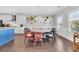 Bright dining area with a round table, colorful chairs, and unique wall decor at 186 Cayman Loop, Pawleys Island, SC 29585