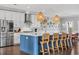 Modern kitchen featuring a large island with barstools, stainless steel appliances, and ample counter space at 186 Cayman Loop, Pawleys Island, SC 29585