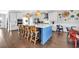 Stylish kitchen with a large blue island, white cabinets, and modern appliances at 186 Cayman Loop, Pawleys Island, SC 29585
