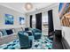 Comfortable living room with blue accents, a plush sofa, and ample natural light at 186 Cayman Loop, Pawleys Island, SC 29585