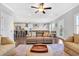 Inviting living room with hardwood floors, a cozy leather sofa, and an open concept design at 186 Cayman Loop, Pawleys Island, SC 29585