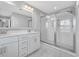 The main bath has a custom glass shower, dual sinks, and a large vanity at 186 Cayman Loop, Pawleys Island, SC 29585