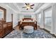 Main bedroom with a coffered ceiling, hardwood floors, and a king size bed at 186 Cayman Loop, Pawleys Island, SC 29585