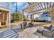 This backyard has an outdoor grill under a wooden pergola for cooking outside at 186 Cayman Loop, Pawleys Island, SC 29585